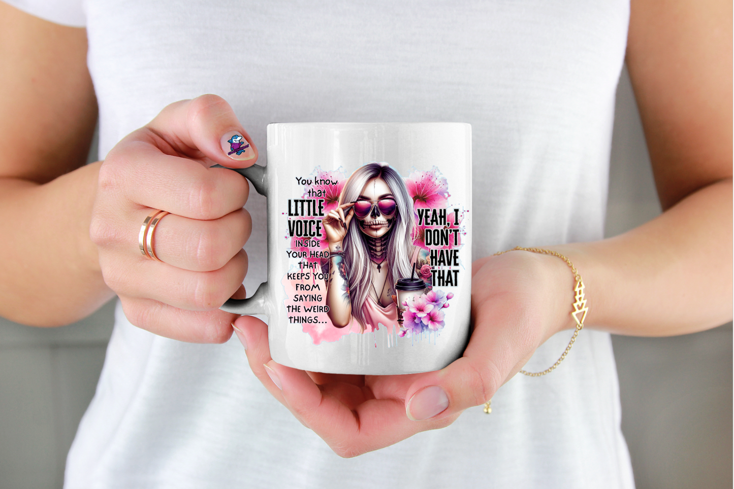 Person holding a mug with a sarcastic colourful design and text little voice in my head yea I don't have that funny cup ideal for gothic halloween christmas or birthday gift