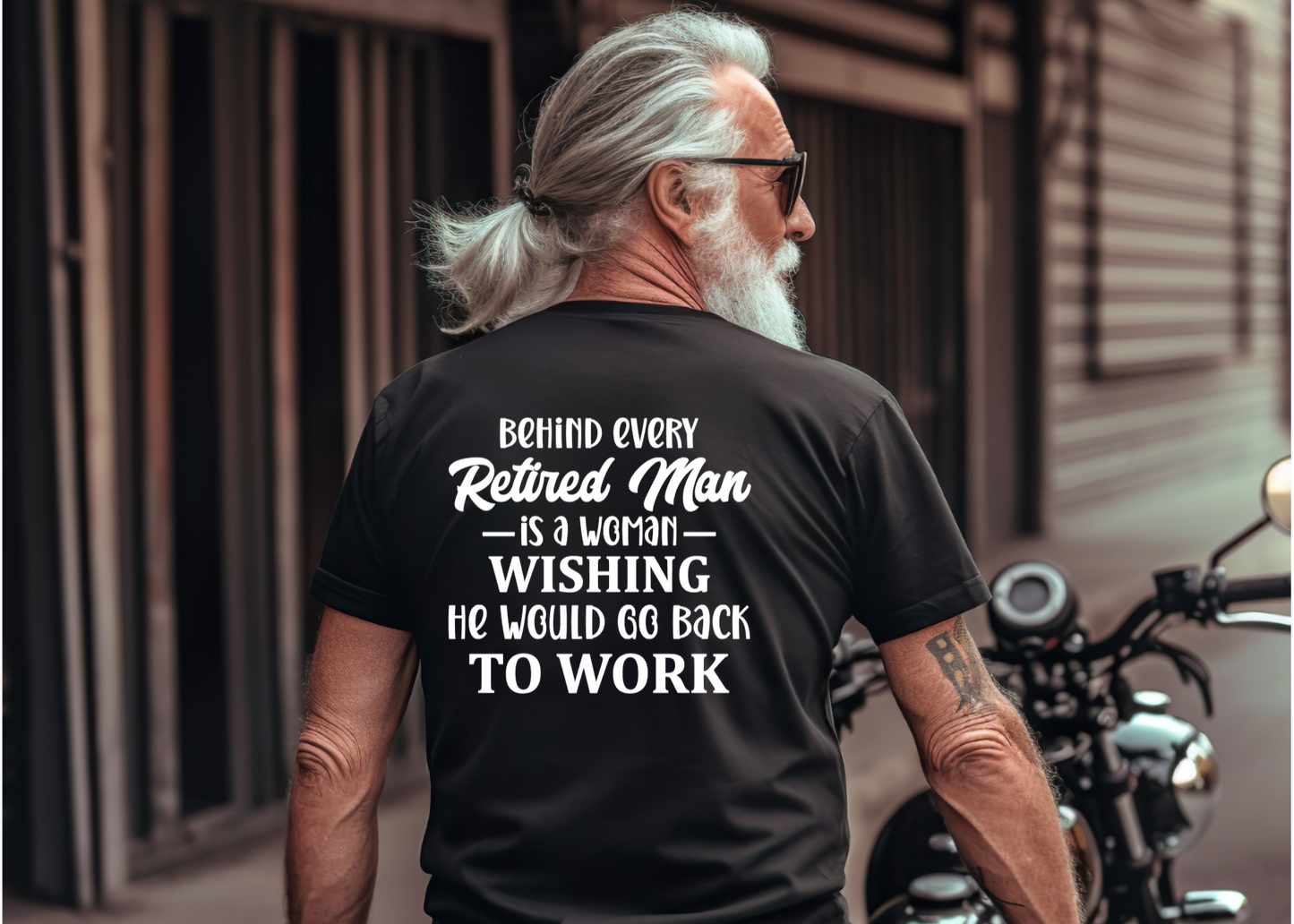Man on a motorcycle wearing a black t-shirt with humorous text Retirement Gift Tshirt