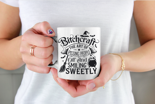 Person holding a mug with a humorous design and text.