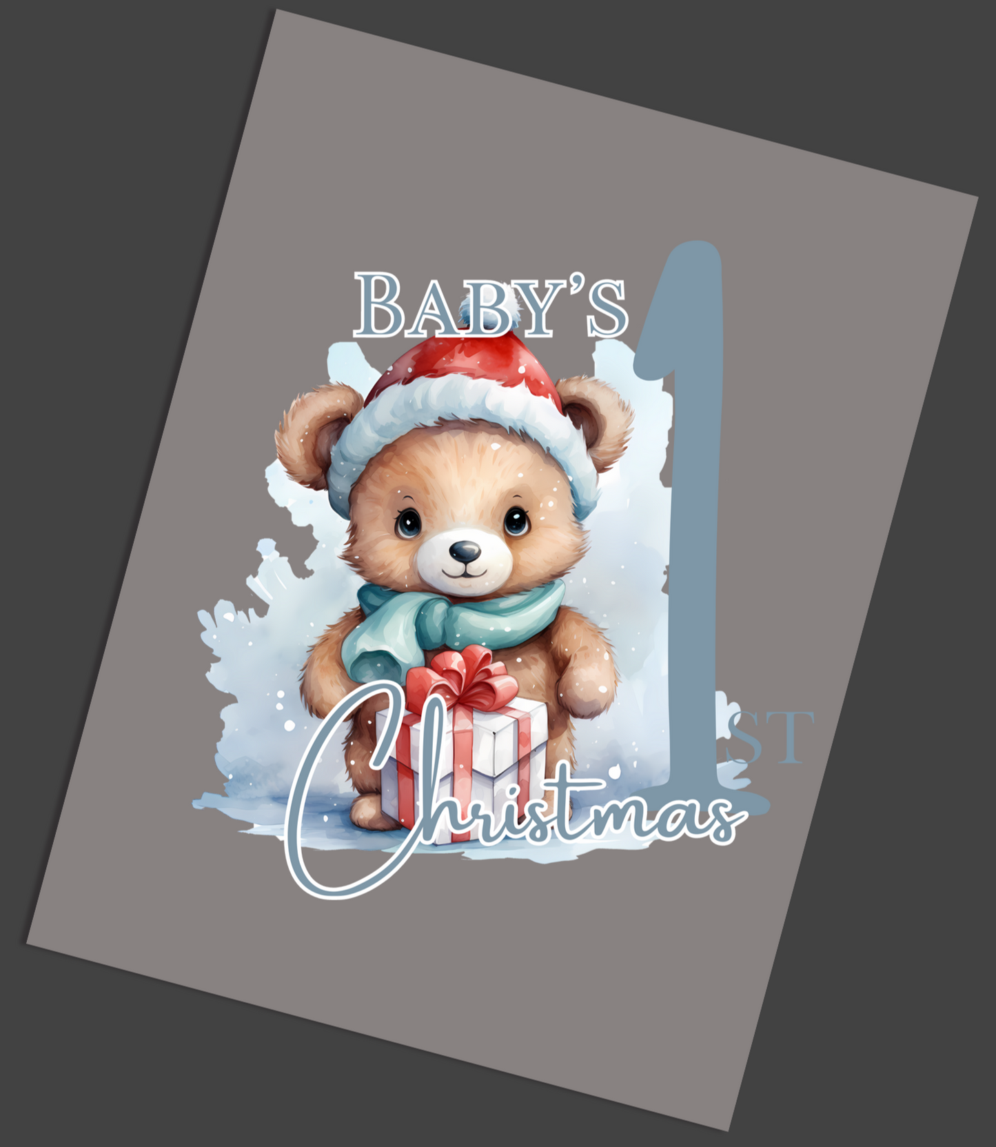Card with a bear illustration and 'Baby's First Christmas' text on a gray background