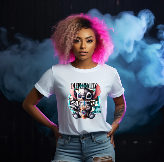 Person wearing a white t-shirt with a colourful graphic design gothic 