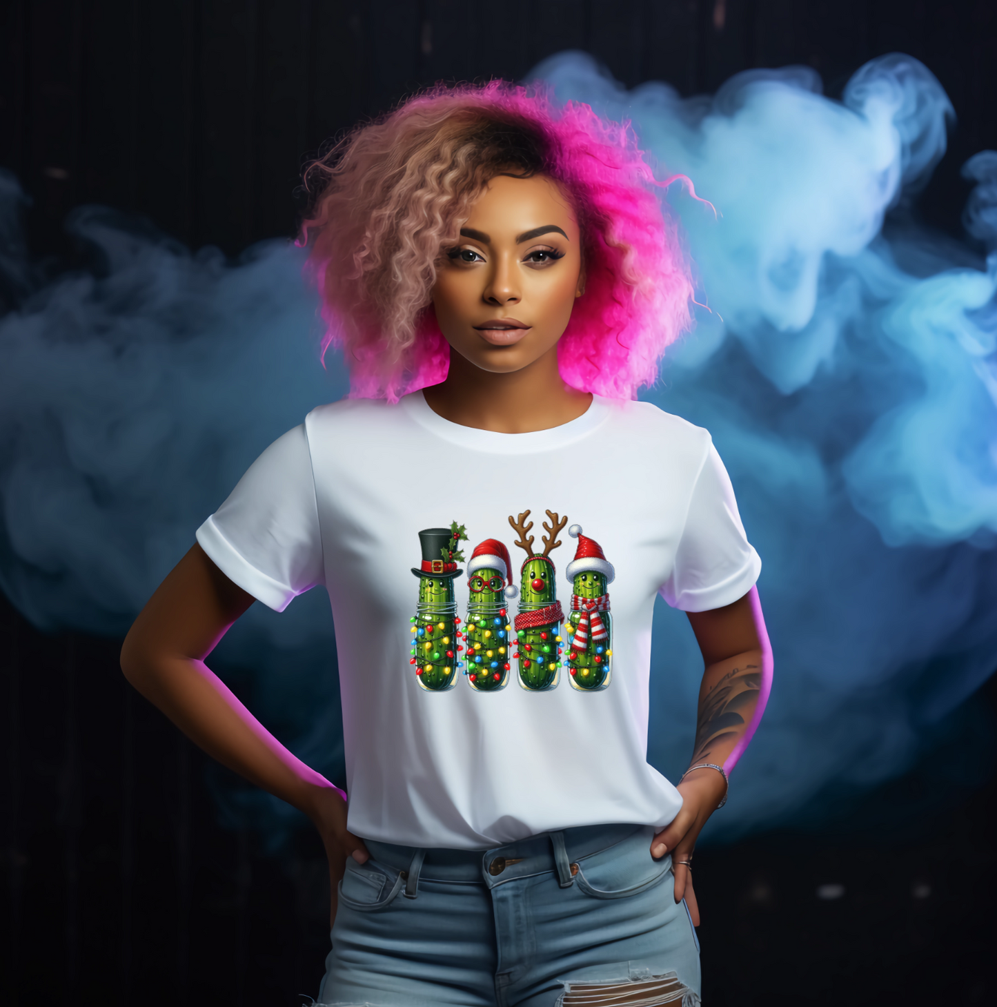 Person wearing a white t-shirt with colourful christmas Pickle designs against a dark background with smoke effects