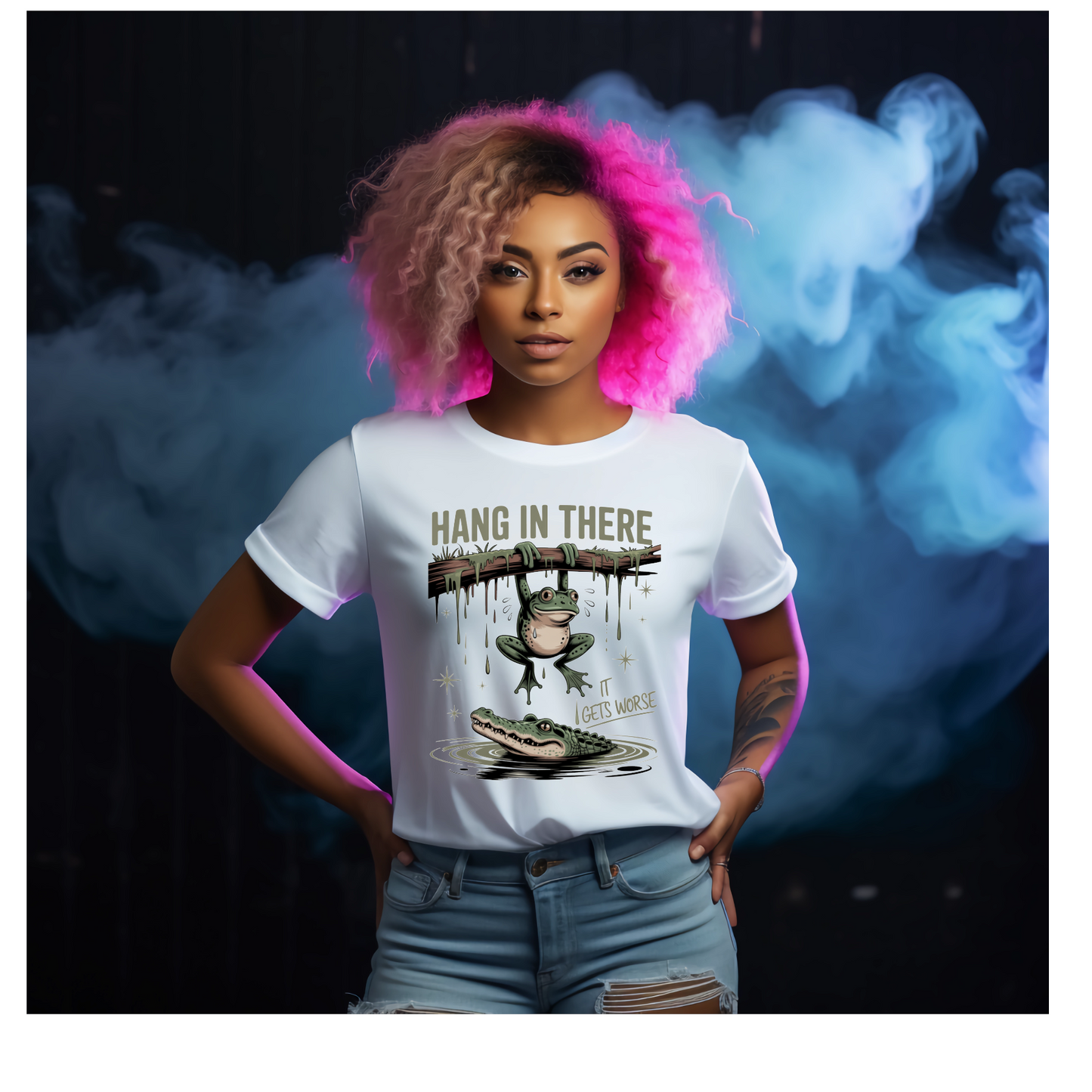 Person wearing a white t-shirt with a graphic design and text saying Hang In There It Gets Worse, standing against a dark background with smoke effects. 