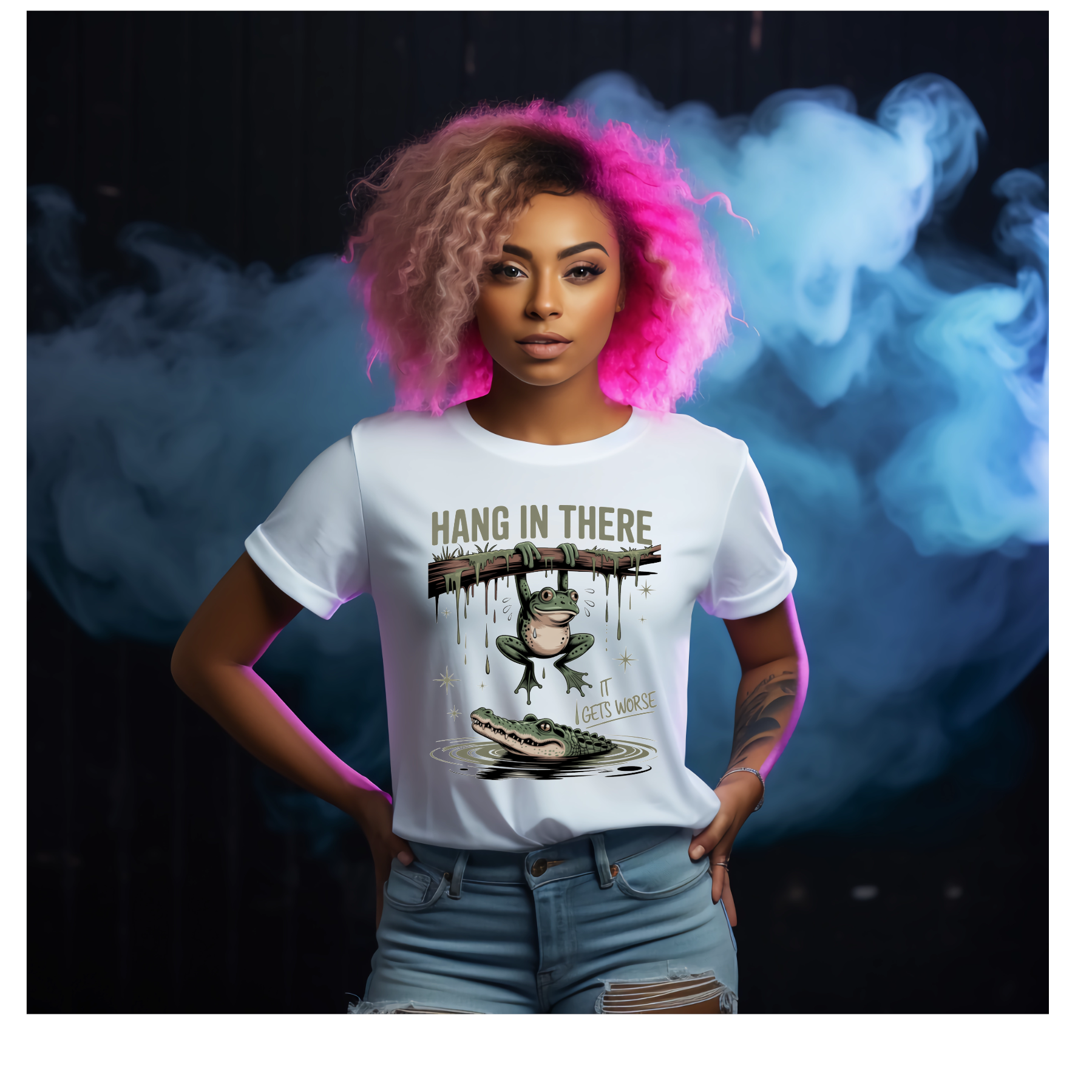 Person wearing a white t-shirt with a graphic design and text saying Hang In There It Gets Worse, standing against a dark background with smoke effects. 