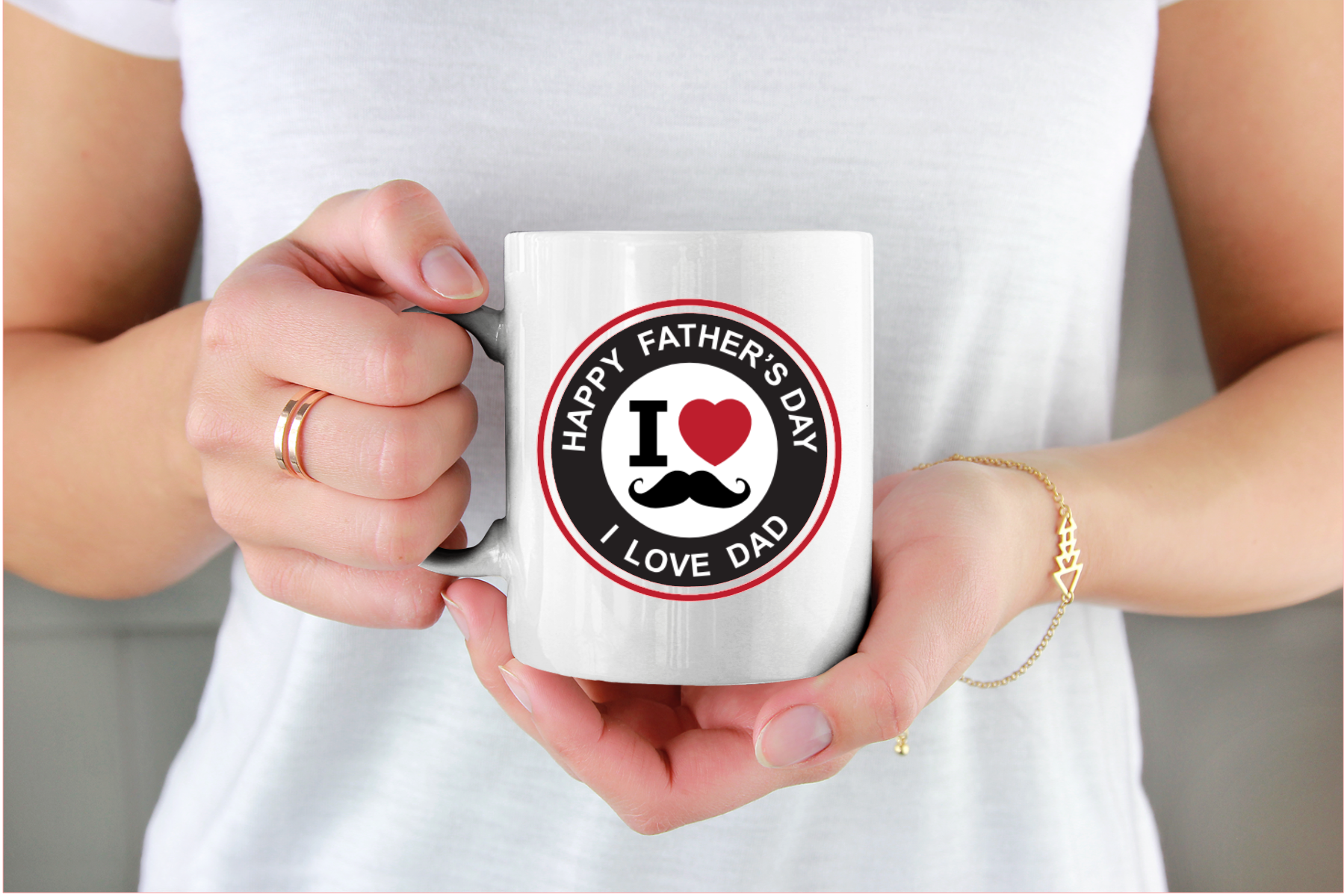 Person holding a mug with a 'Happy Father's Day, I Love Dad' design.