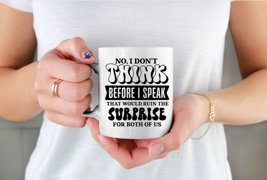 Person holding a white mug with humorous text design.