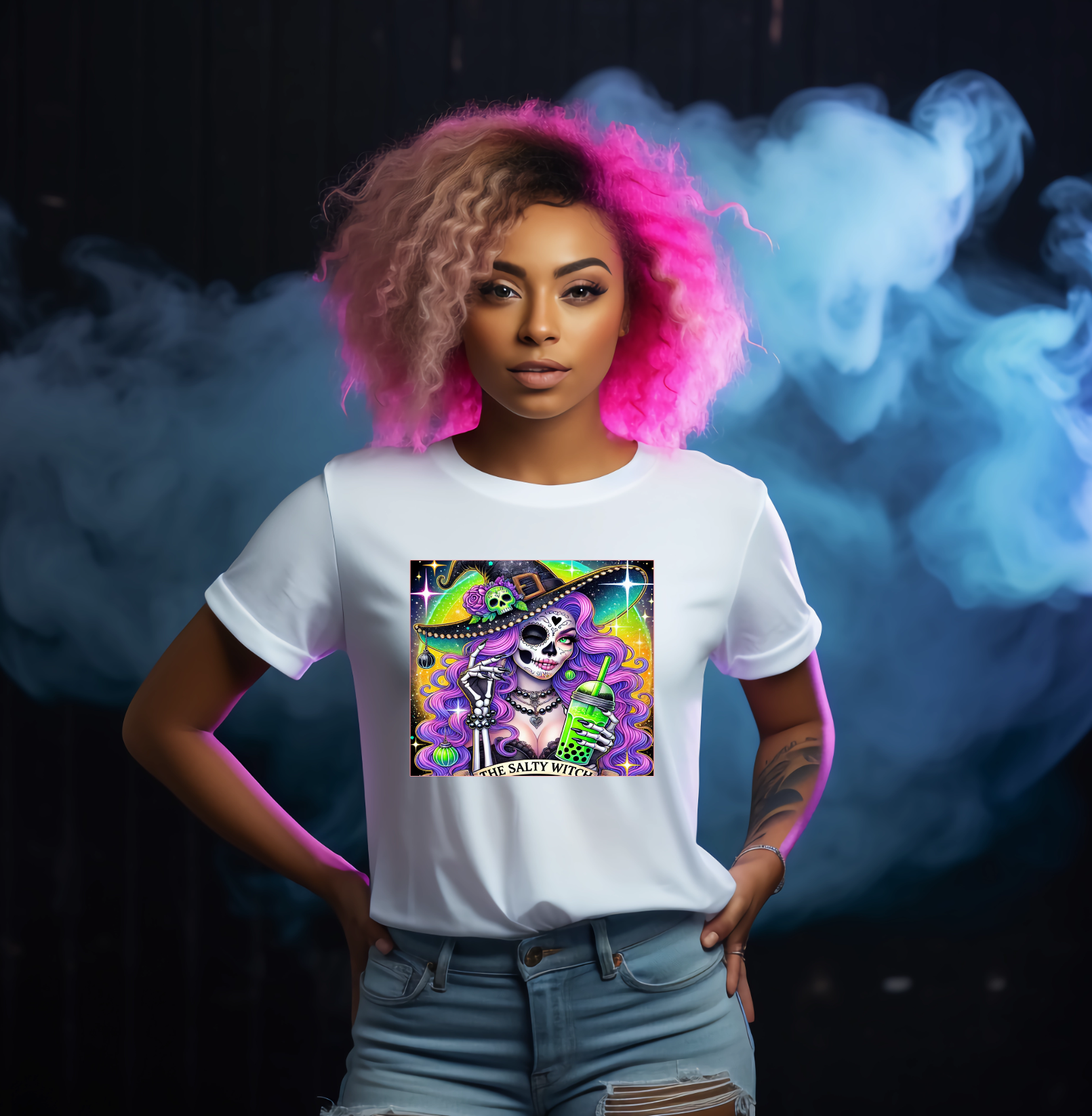 Person wearing a white t-shirt with a colorful graphic design against a dark background with smoke effects.
